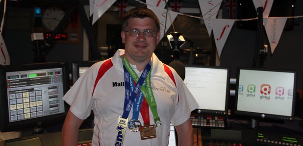 Matt Gubbins shows off his marathon medals